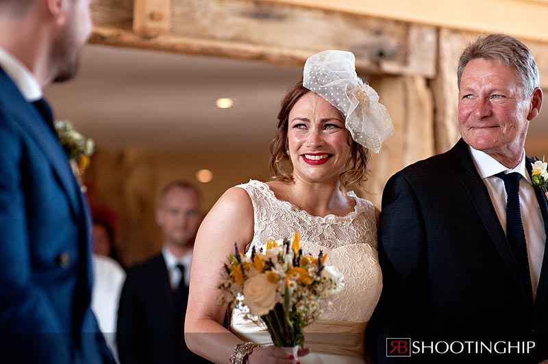 Bride down the aisle at Bury Court Barn