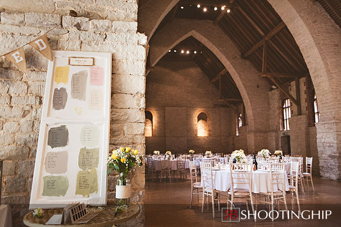 Farrow and Ball Wedding Idea Table Plan Example featuring view of Tithe Barn