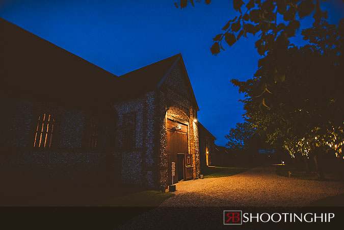 Exterior night photograph of tithe barn