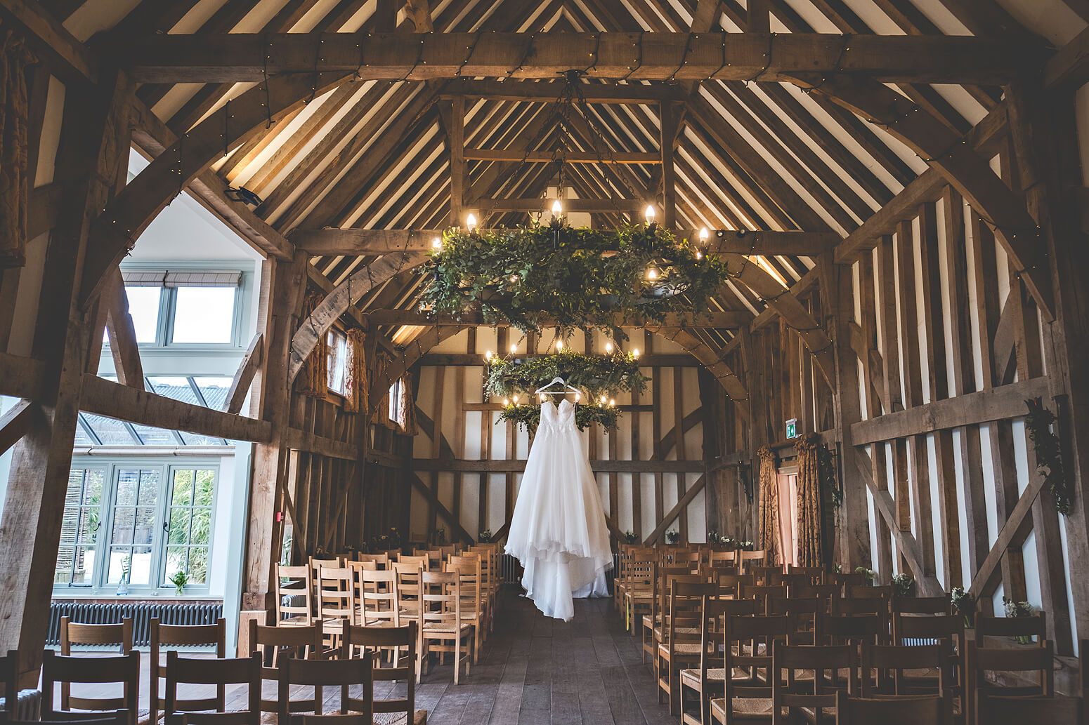 Brides dress hanging at Gate Street Barn