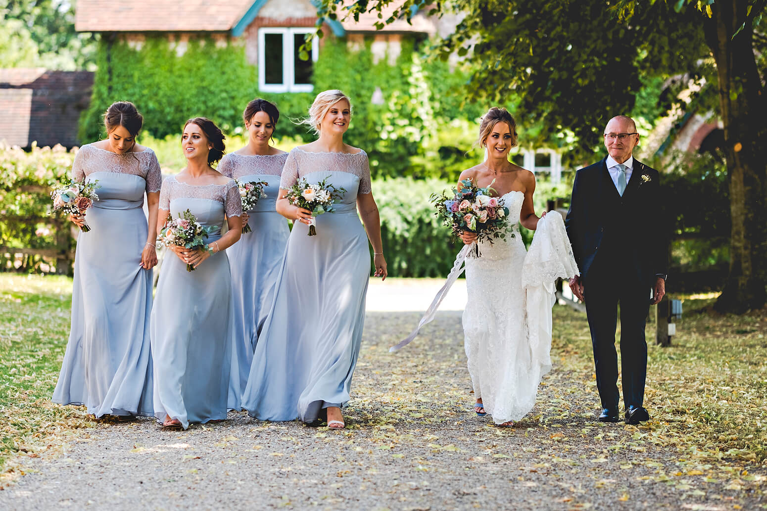 Bride walking up lane at Tithe Barn