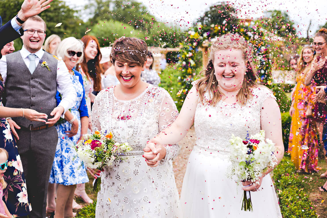 Two Brides with Confetti at the Secret Garden in Kent