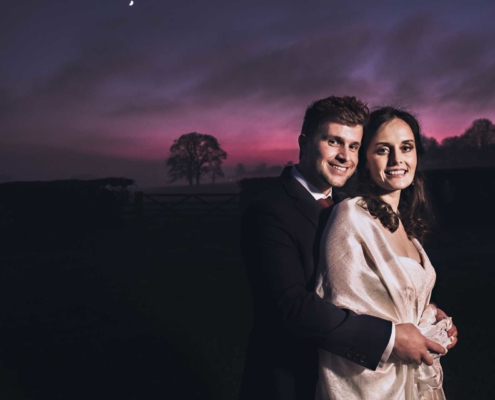 Dramatic sunset for Bride and Groom at Farbridge Barns