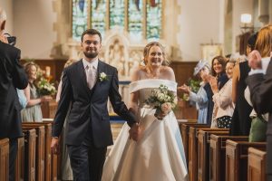 Giddy couple leaving the church