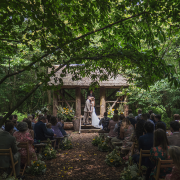 Woodland wedding bride and groom gate street barn